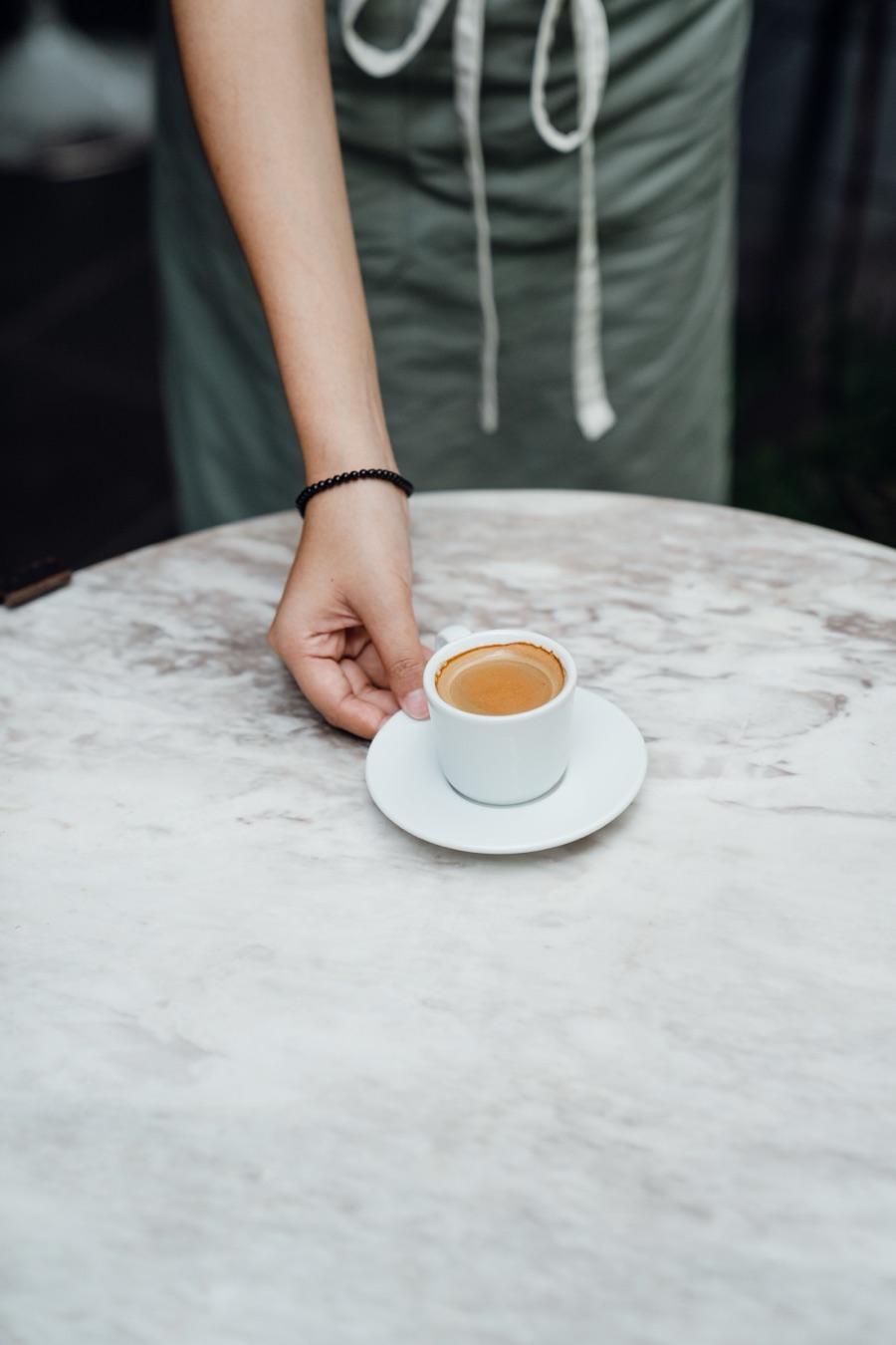 An espresso served at a local café table